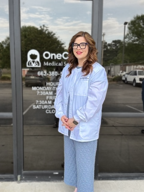Primary care provider Cassie standing outside OneCare Medical clinic in Oxford MS.